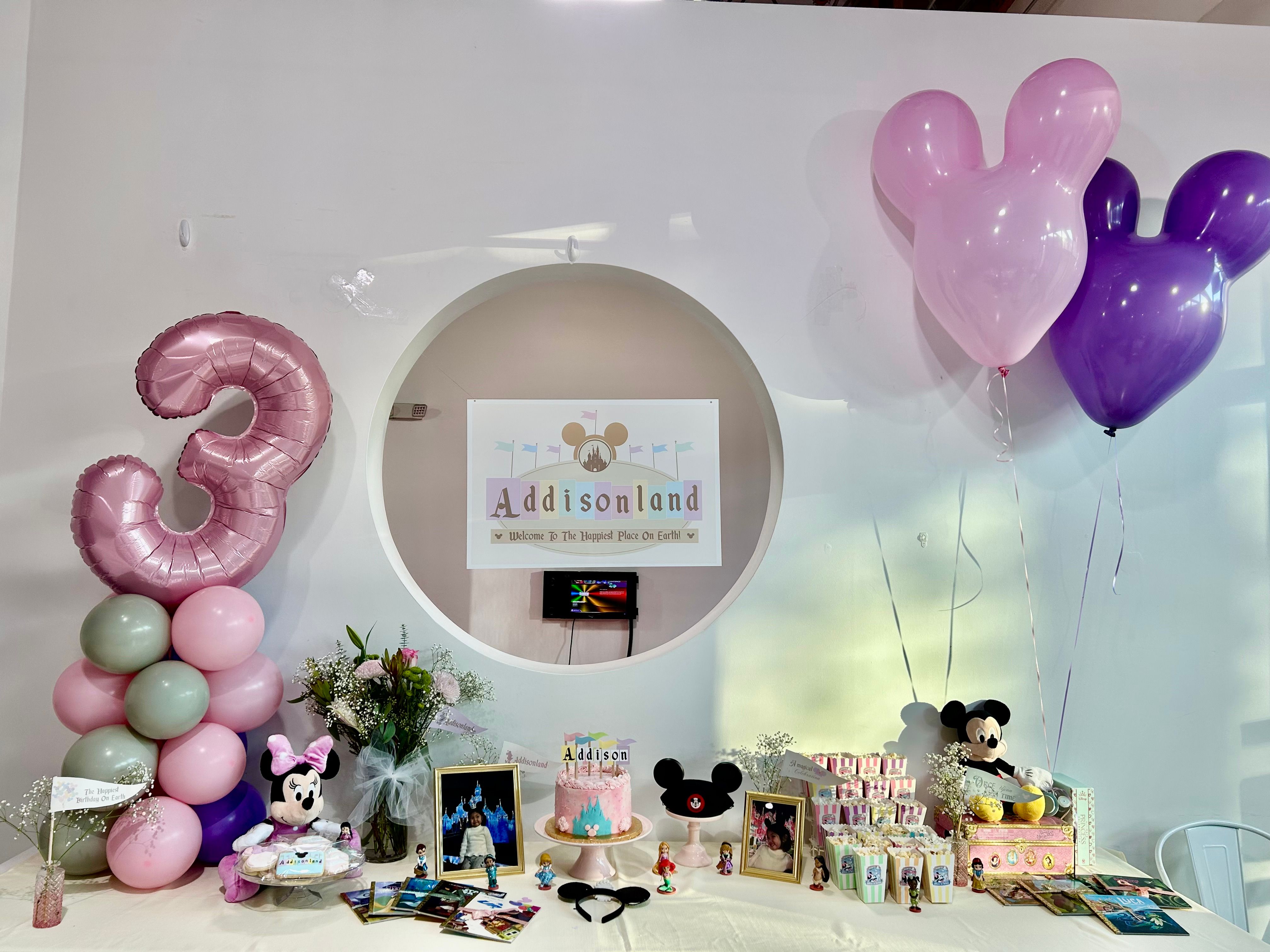 Disney themed Addisonland birthday party with stunning pink and purple balloon installation